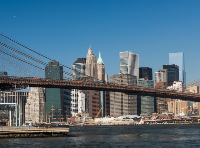 The skyline of NYC including the Brooklyn Birdge and the One World Trade Center